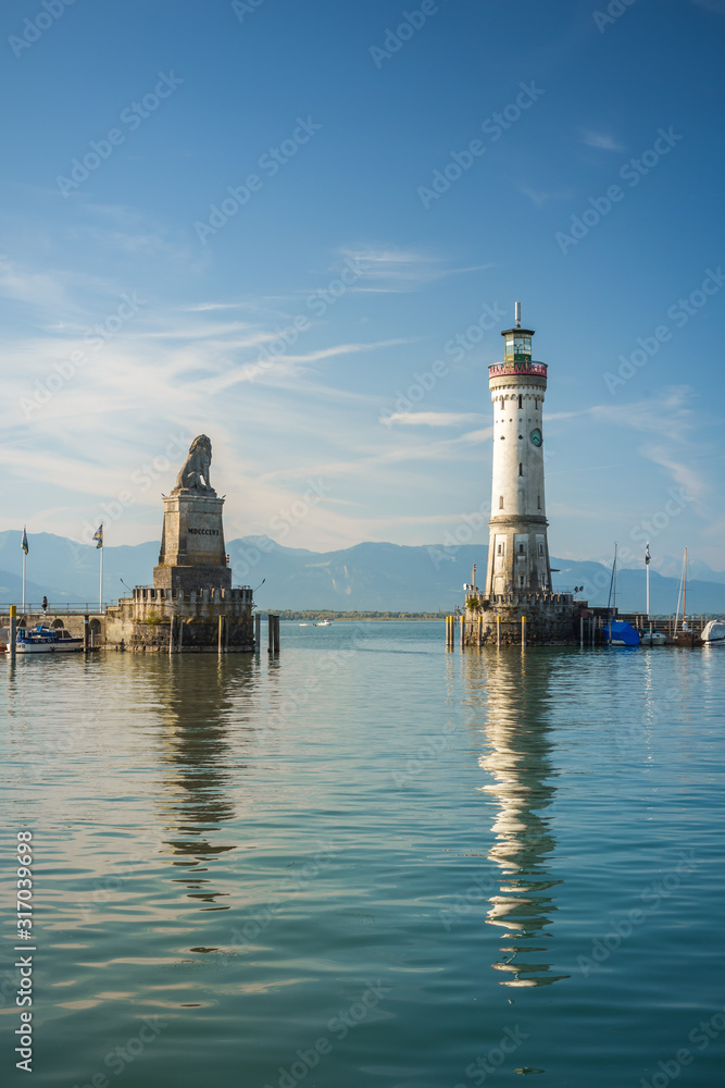 Harbour entrance of Lindau, Lake Constance - Germ. - Bodensee - with the new lighthouse and the Bavarian Lion. The Lindau lighthouse is the southernmost lighthouse in Germany