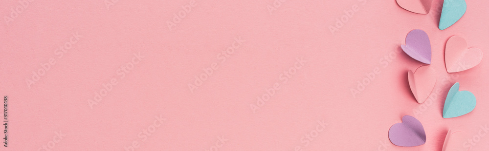 top view of colorful paper hearts on pink background, panoramic shot