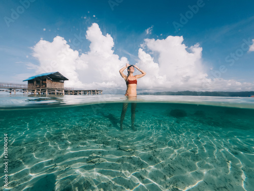 Tableau sur toile Happy female scuba diver enjoying summer getaway holidays for recreate at sea, w