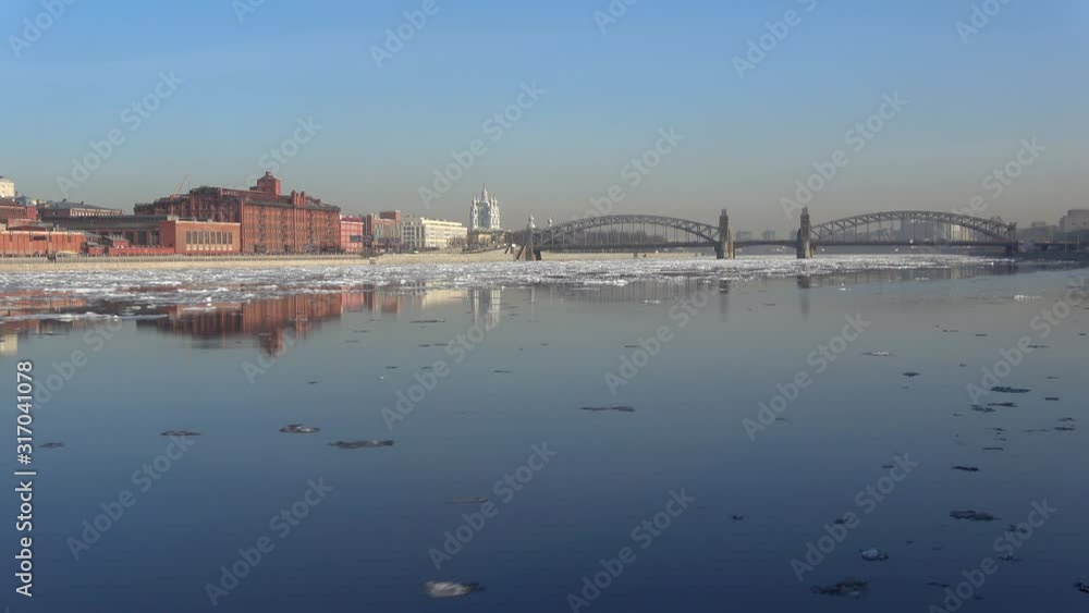 View of the Bolsheokhtinsky (Peter the Great) bridge during the spring ice drift (timelapse). Saint Petersburg, Russia View of the Bolsheokhtinsky (Peter the Great) bridge during the spring ice drift (timelapse). Saint Petersburg, Russia