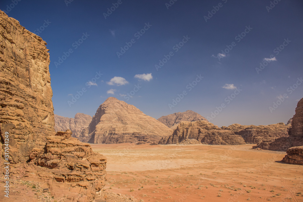 Wadi Rum Jordan Middle East desert scenery top view sand valley surrounded by dry rocky mountains picturesque landscape from above, copy space Wadi Rum Jordan Middle East desert scenery top view sand valley surrounded by dry rocky mountains picturesque landscape from above, copy space