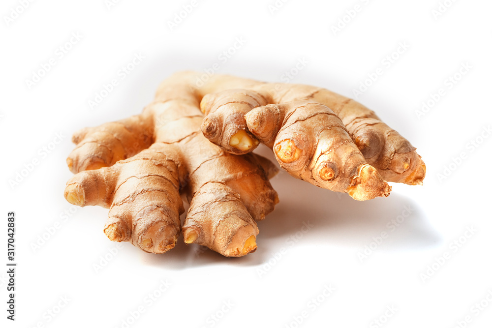 Fresh ginger root on a white background, isolate close-up.