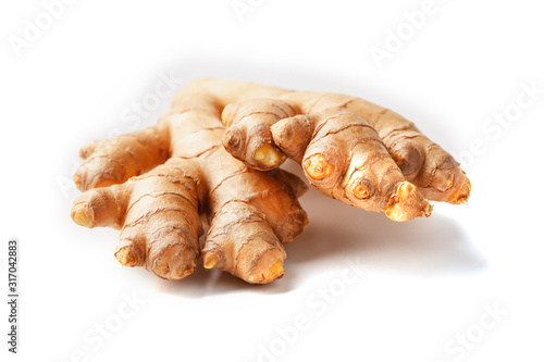 Fresh ginger root on a white background, isolate close-up.
