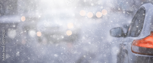 view of the winter road from the car, traffic in the seasonal city, bad weather in the northern city