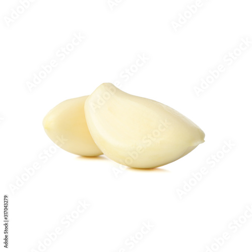 Fresh garlic slices isolated on white background
