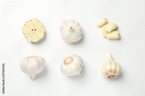 Photography Flat lay with garlic bulbs on white background, top view