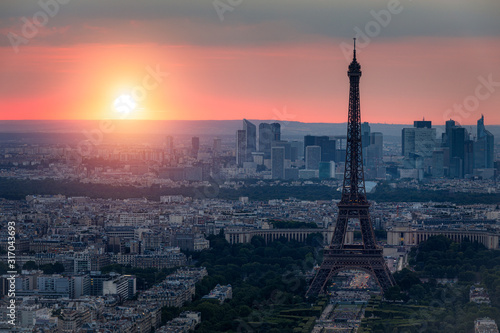 Panoramic aerial view of Paris, Eiffel Tower and La Defense business district. Aerial view of Paris at sunset. Panoramic view of Paris skyline with Eiffel Tower and La Defense. Paris, France. © daliu