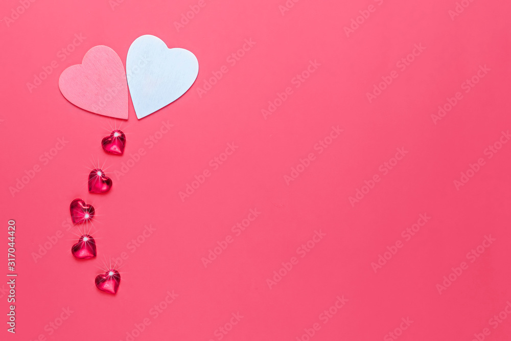 Valentines day background with two hearts on red background. Place for text.