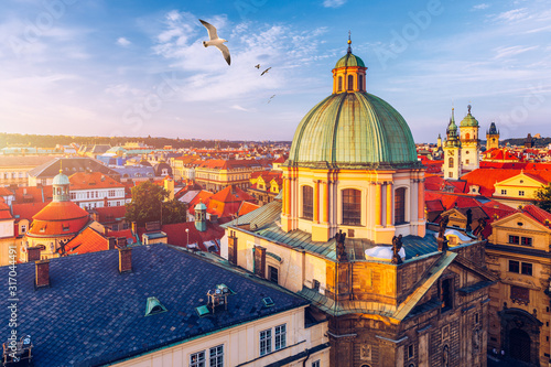 Wallpaper Mural Aerial panorama view with flying birds of the Old Town in Prague, Czech Republic. Red roof tiles panorama of Prague old town.  Prague Old Town Square houses with traditional red roofs. Czechia. Torontodigital.ca