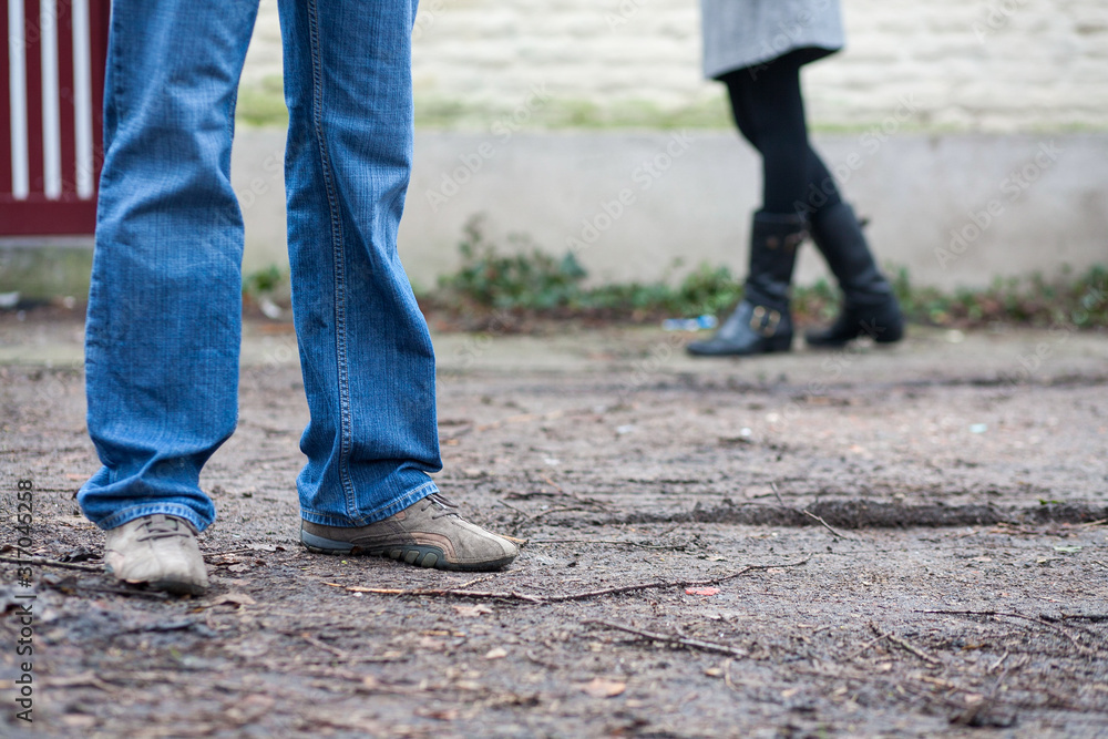 Close up of male and female's feet, a couple in love