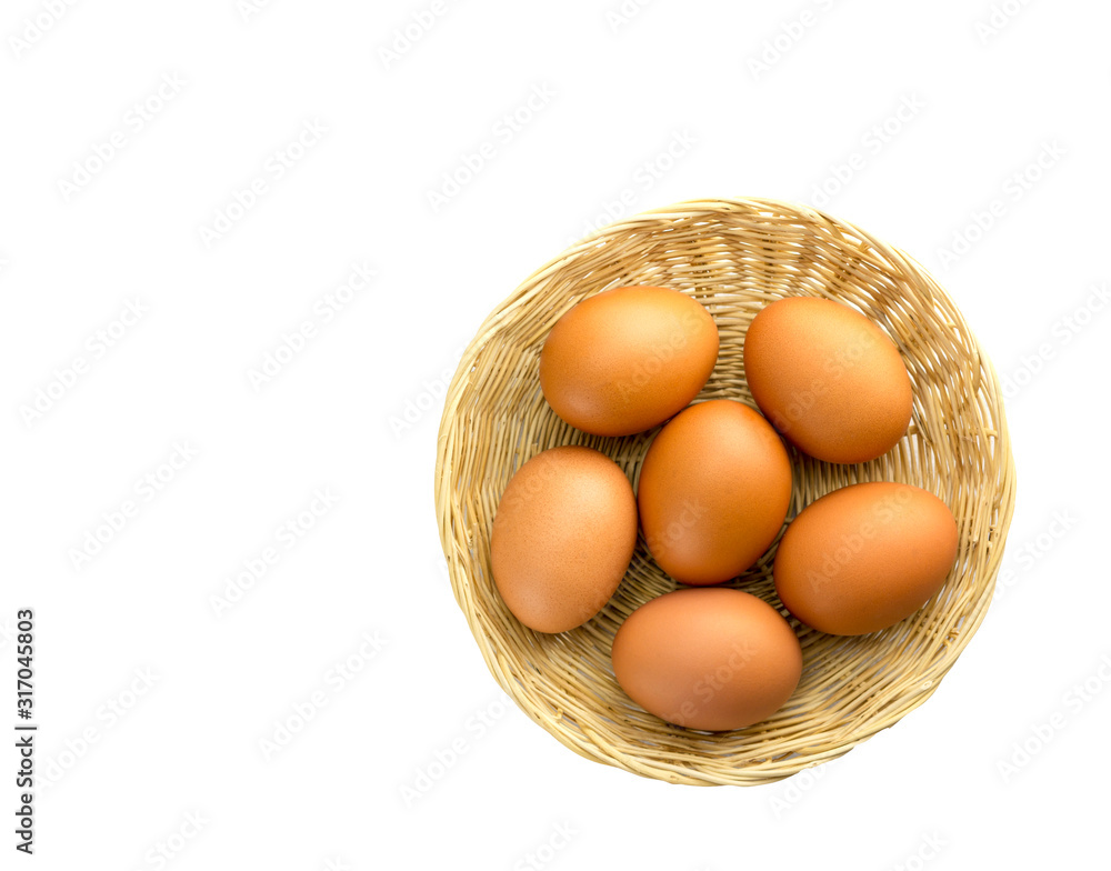 Eggs placed in a woven wooden basket.