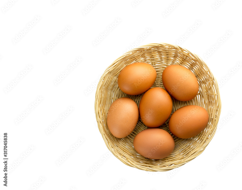 Eggs placed in a woven wooden basket.