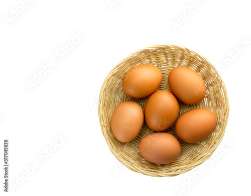 Obraz na płótnie Eggs placed in a woven wooden basket. w salonie