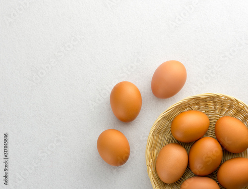 Obraz na płótnie Eggs placed in a woven wooden basket. w salonie