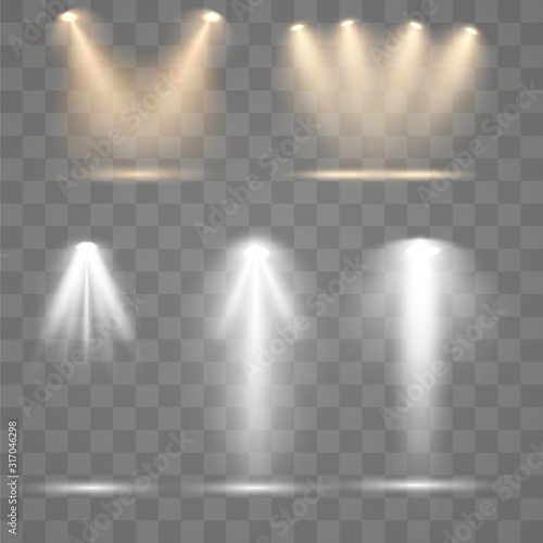 Set of golden spotlight isolated on transparent background. Glowing light effect with gold rays and beams. Scene floodlight spotlight stage beam.