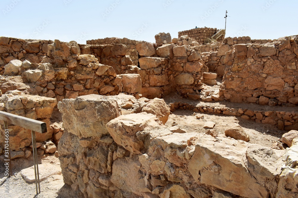 Ruins of the ancient Masada, a mountaintop fortress, near the Dead Sea ...