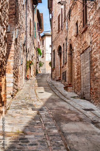 Narrow street in the smal viallge of Spello, Italy