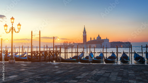 Sunrise in San Marco square, Venice, Italy. Venice Grand Canal. Architecture and landmarks of Venice. Venice postcard with Venice gondolas