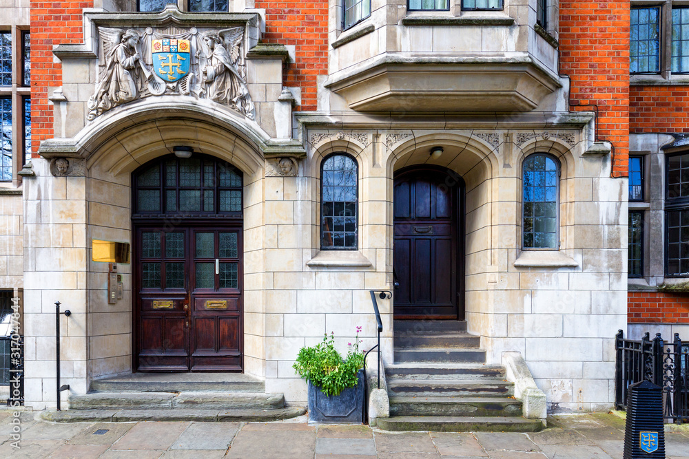 Typical street scene in the central London district with familiar architecture facades to urban housing. Typical street scene in the central London district with familiar architecture facades to urban housing.