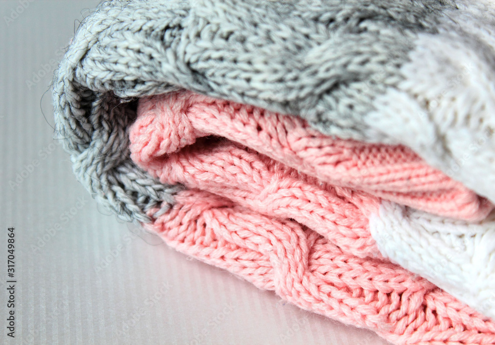 One folded grey and pink warm knitted sweater One folded grey and pink warm knitted sweater