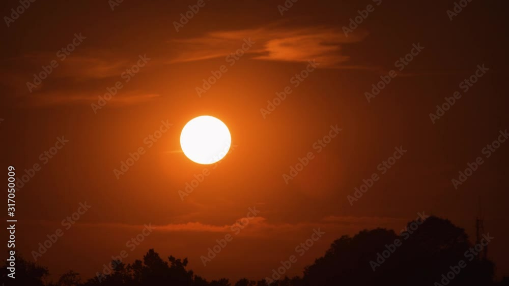 Tracking shot close up view of an airplane silhouette flying above the sun at sunset Tracking shot close up view of an airplane silhouette flying above the sun at sunset