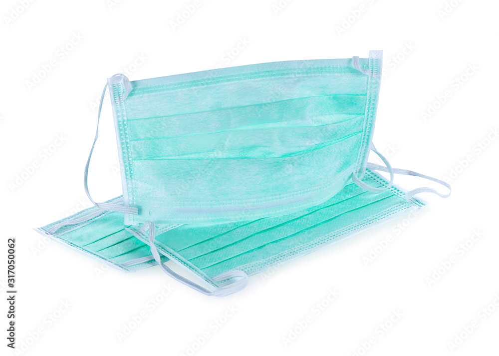 The masks for hospital use are effective in filtering dust and bacteria. Isolated on white background The masks for hospital use are effective in filtering dust and bacteria. Isolated on white background