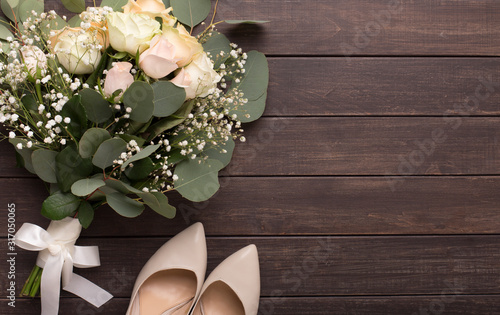 Beautiful luxury wedding bouquet and heels for bride