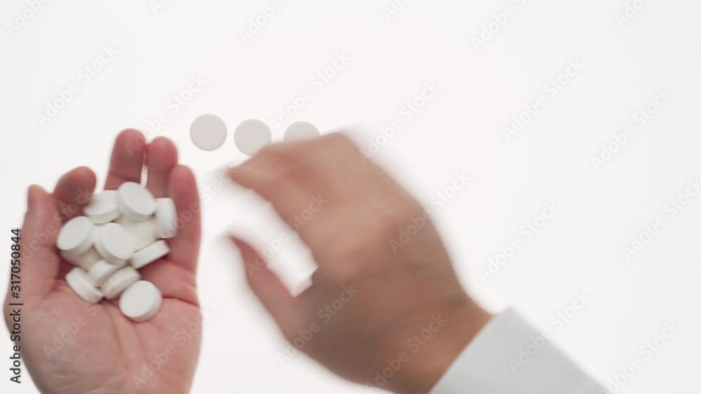 Man hand with pills, tablets, vitamins, drugs, capsules isolated on white background. White shirt, business style. Health care concept. Pharmaceutical industry. Pharmacy. Man hand with pills, tablets, vitamins, drugs, capsules isolated on white background. White shirt, business style. Health care concept. Pharmaceutical industry. Pharmacy.