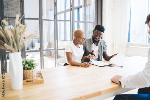 Canvas-taulu African American couple reading estate contract