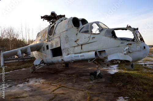 old broken military helicopter without blades and glasses