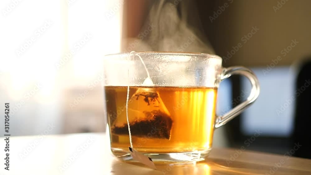 Brew a cup of black tea in the early morning. HD, 1920x1080, slow motion Brew a cup of black tea in the early morning. HD, 1920x1080, slow motion