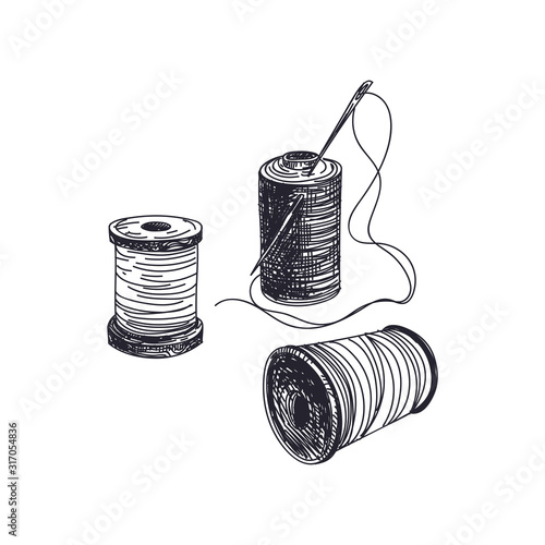 Thread spools with needles hand drawn vector illustration
