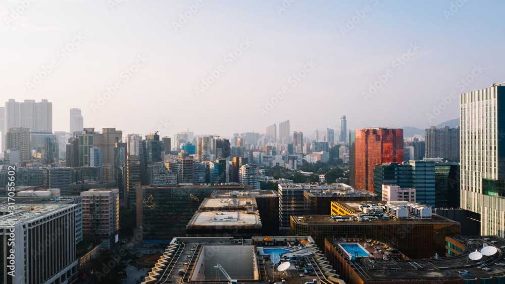 Aerial scenery panoramic view from drone of Hong Kong skyscrapers skyline metropolitan landscape. Modern concrete cityscape of urban downtown with business and financial buildings. City infrastructure