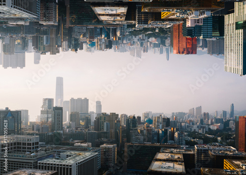 Futuristic multiverse world concept. Downtown with skyscrapers skyline under and cityscape over. Two parallel worlds. Alternative reality dimension photo
