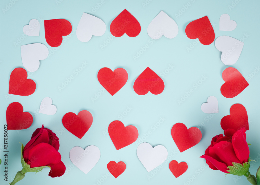 Red hearts and red roses on a blue background.