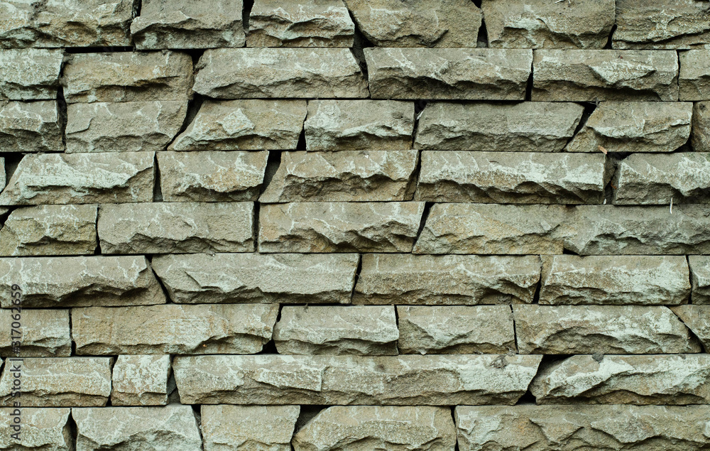 Fototapeta premium Brick wall of an old building. The structure of the stone. Brickwork. Stone wall.