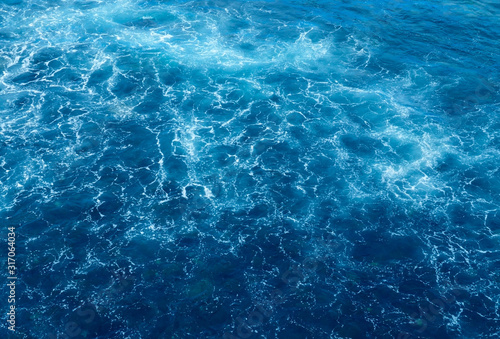 Abstract blue ocean water background.Sea waves natural texture.Selective focus.