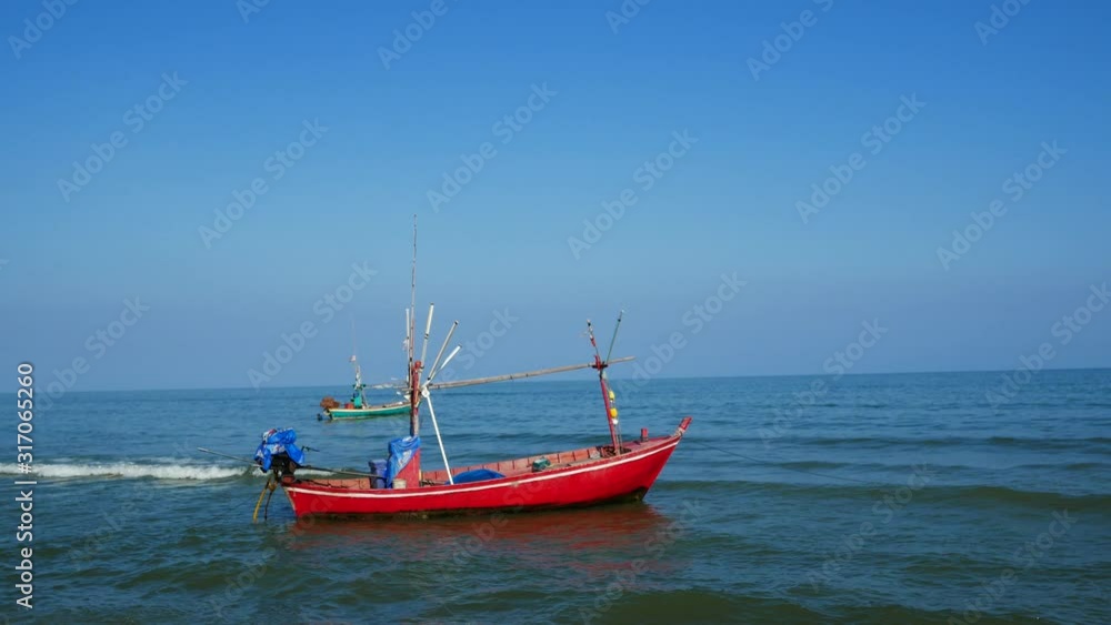 Fishing boat on seascape background. Thai fishing boat used as a vehicle for finding fish in the sea. Fishing boat on seascape background. Thai fishing boat used as a vehicle for finding fish in the sea.