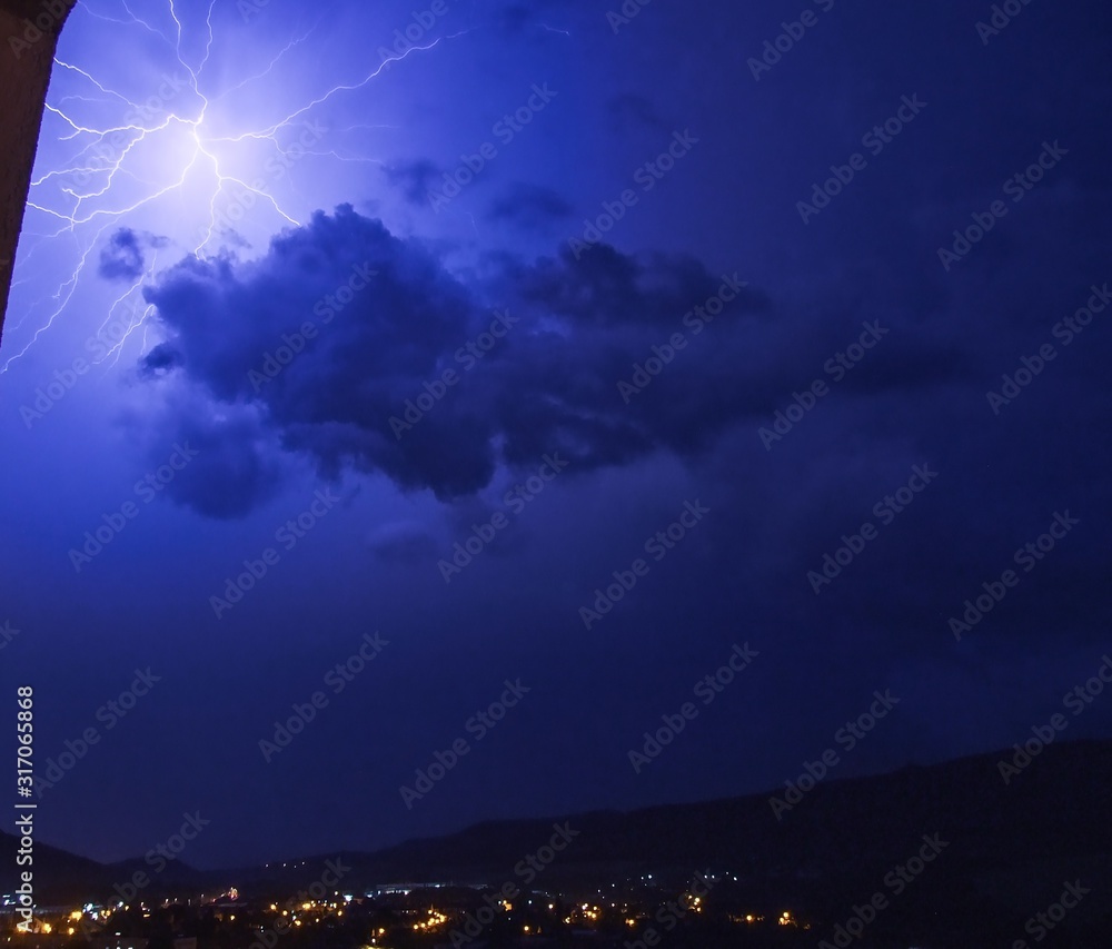 Naklejka premium Storm over city