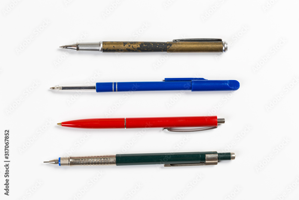 Collection of multi-colored ballpoint pens isolated on a white background Collection of multi-colored ballpoint pens isolated on a white background