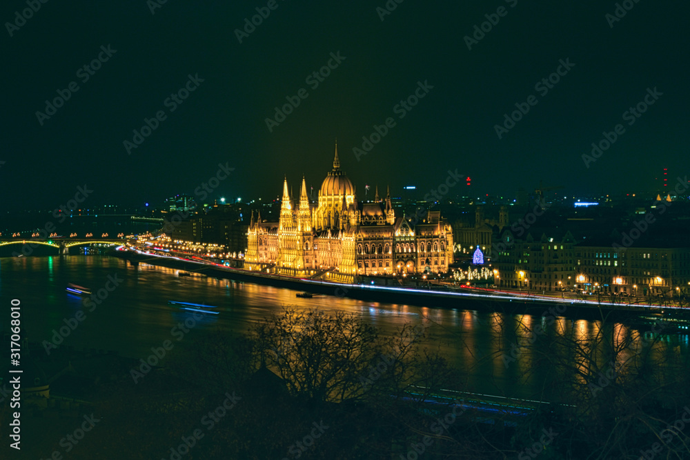 Fototapeta premium Hungarian Parliament illuminated at night in Budapest, Hungary
