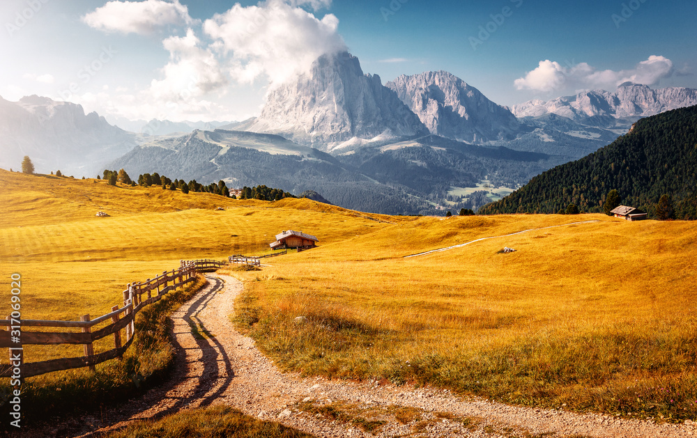 Incredible landscape in Val Gardena on a sunny day. Scenic image of famous Sassolungo peak. Amazing nature background.  Dolomiti, Trentino Alto Adige, province Bolzano, Italy, Europe.