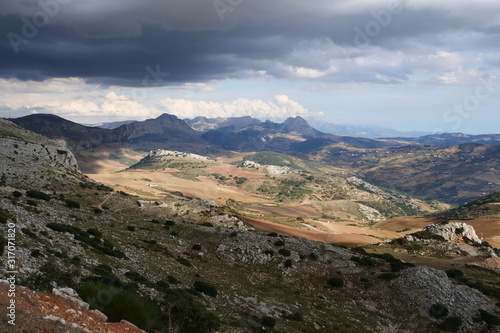 Beautiful panorama view on a superb mountain landscape from the viewpoint "el Mirador de Manuel Grajales" at the bottom of El Torcal de Antequera, Malaga Province, Spain, Europe © Thomas
