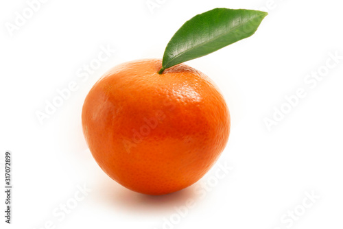 Single mandarin with leaf isolated