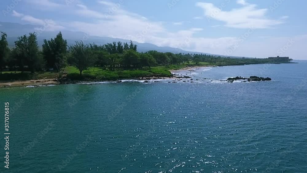Fabulous seascape with turquoise sea on shore of tropical island with green trees and rocky beach in Hawaii Fabulous seascape with turquoise sea on shore of tropical island with green trees and rocky beach in Hawaii