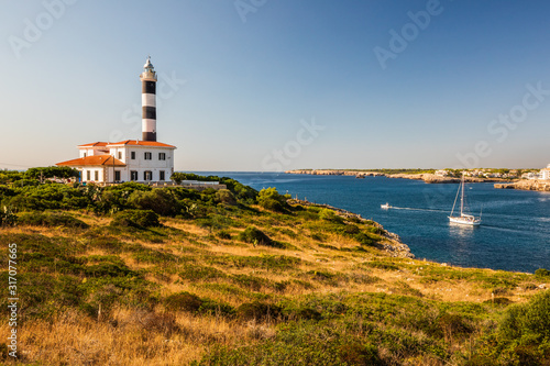 Portocolom lighthouse with boat below, Mallorca