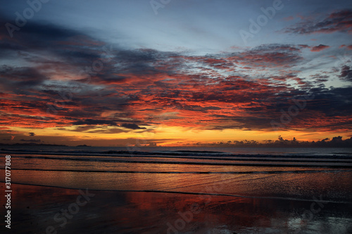 Seascape with a vibrant sunset over a calm sea