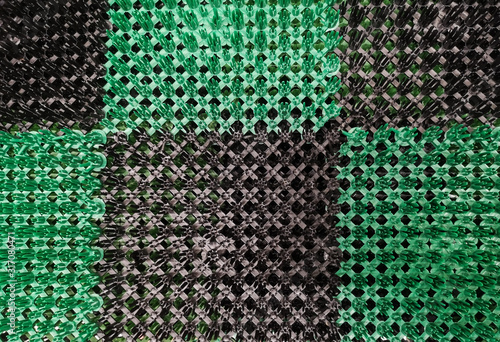 texture of a street rug anti-slip rug with green and black squares