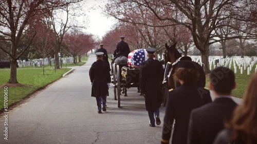Military Funeral Procession Follow Horse Drawn Hearse for Veteran