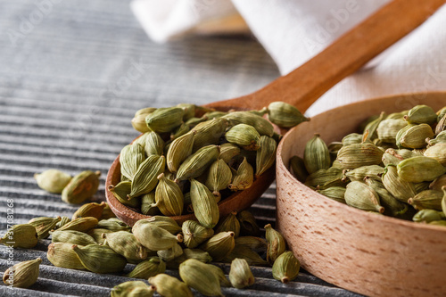 fragrant green cardamom on a wooden rustic background